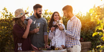 group of friends drinking wine outdoors