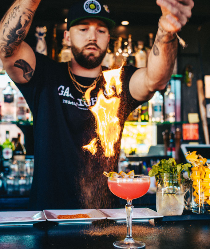 bartender creating a watermelon lime cocktail