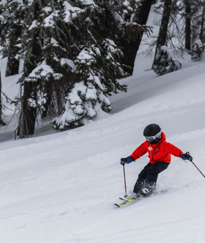person skiing down hill