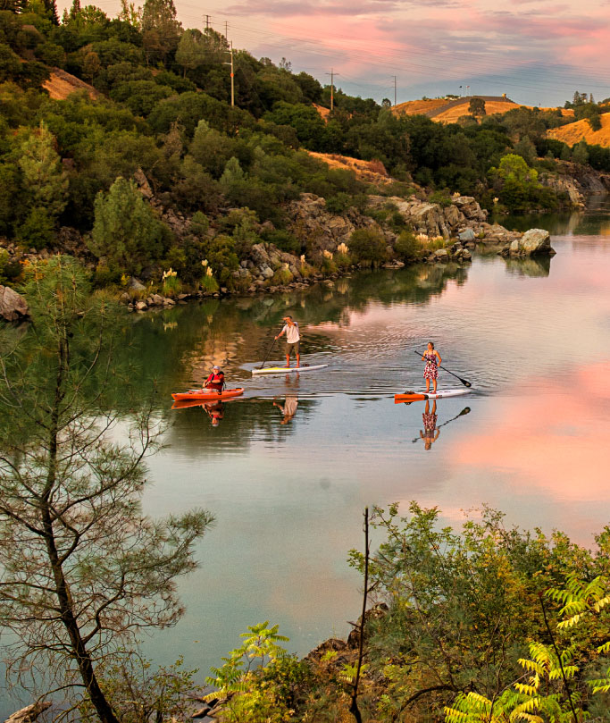 people kayaking and paddle boarding in Folsom