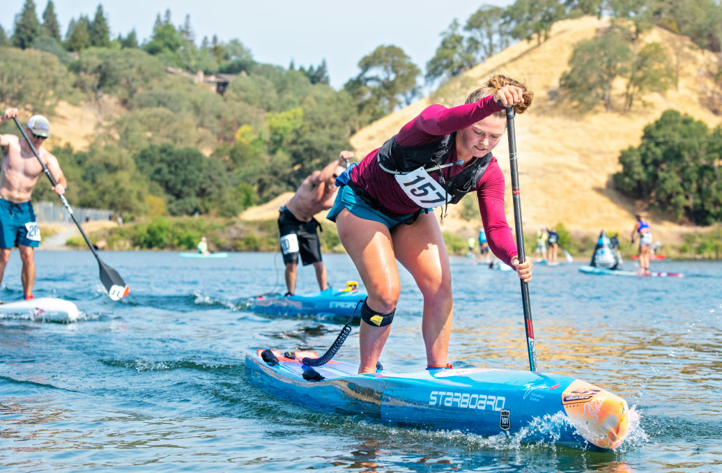 woman standup paddleboarding