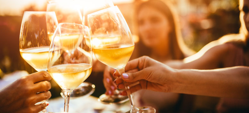 People toasting with wine glasses