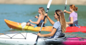 girls kayaking together