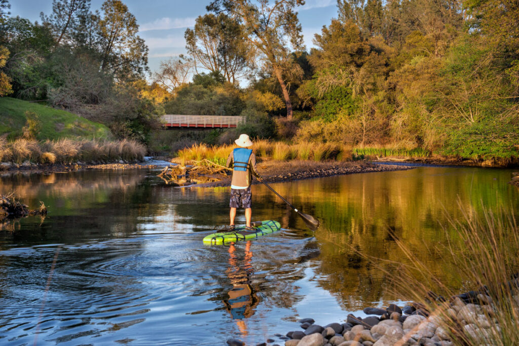 Someone paddle boarding on willow creek