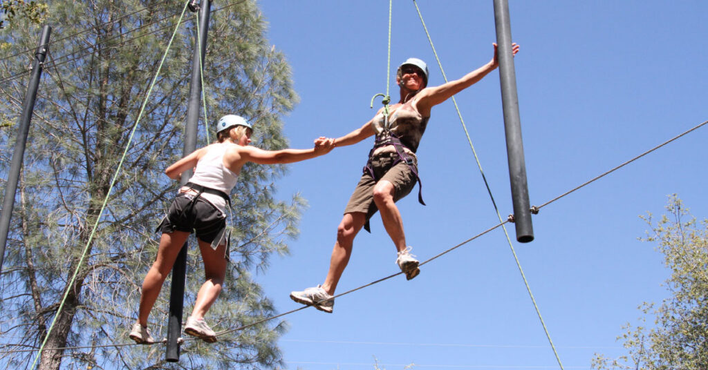 two friends on a ropecourse