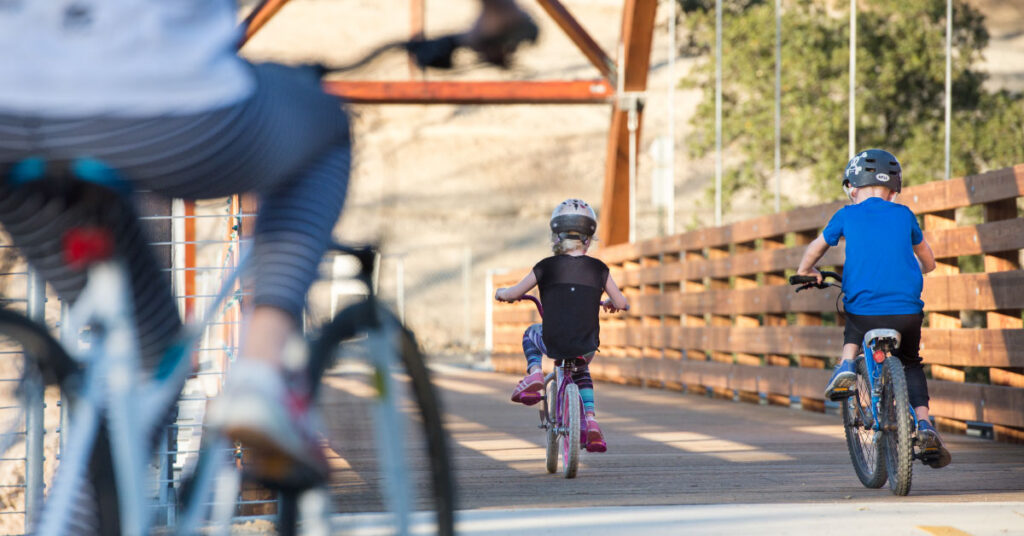 kids cycling on johnny cash trail