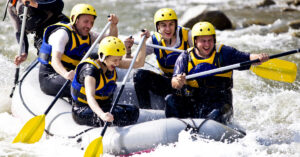 group of people on a raft going down a river